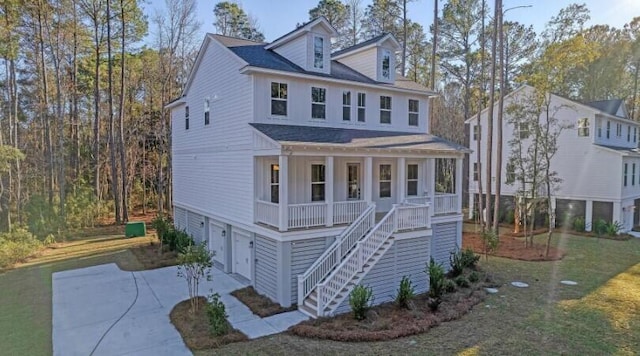 view of front of house featuring a garage and a porch