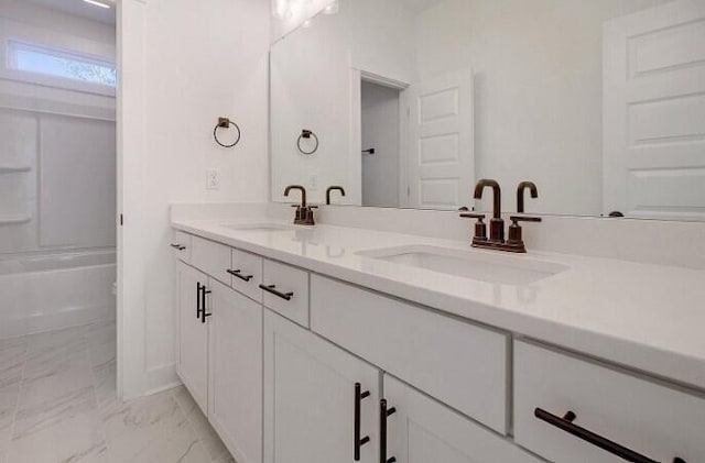 bathroom with vanity and shower / tub combination