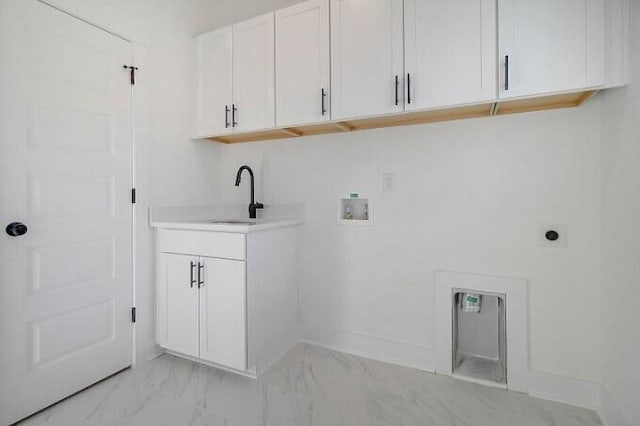 laundry area featuring washer hookup, electric dryer hookup, sink, and cabinets