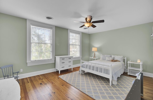 bedroom with hardwood / wood-style flooring and ceiling fan