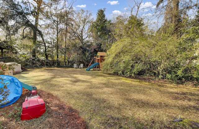 view of yard with a playground