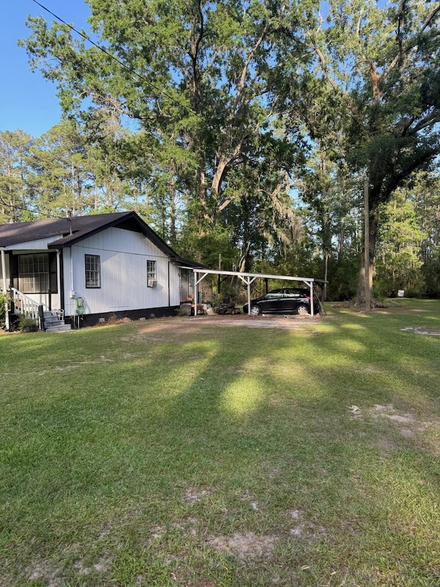 3637 Prices Bridge Ln, Walterboro, SC 29488 - view of grassy yard with entry steps and a carport