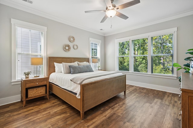 bedroom featuring ceiling fan, dark hardwood / wood-style floors, and crown molding