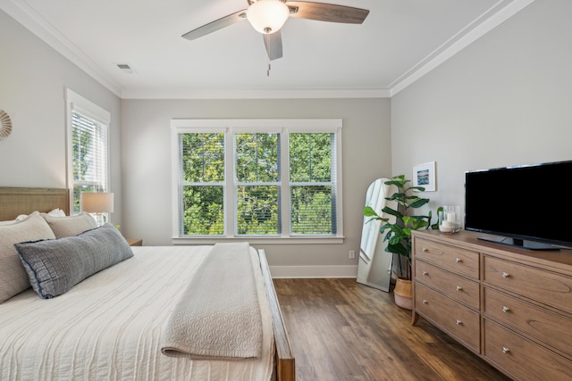 bedroom with ceiling fan, dark hardwood / wood-style flooring, and crown molding