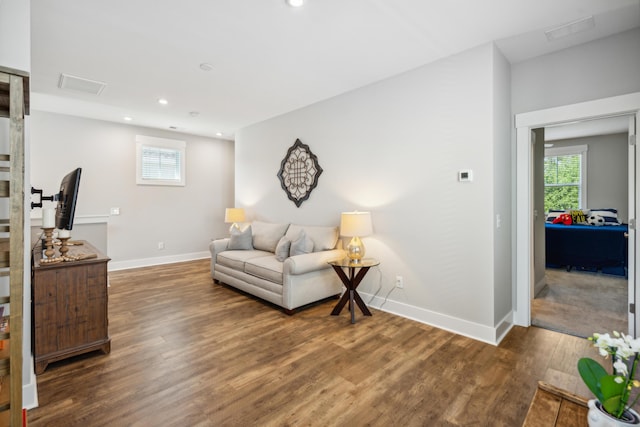 living room with dark hardwood / wood-style floors