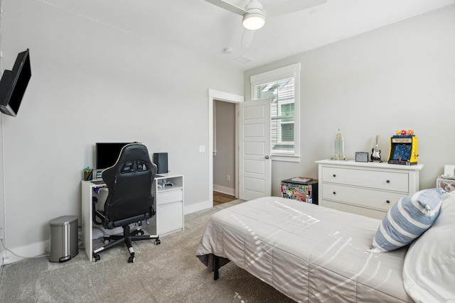 carpeted bedroom featuring ceiling fan