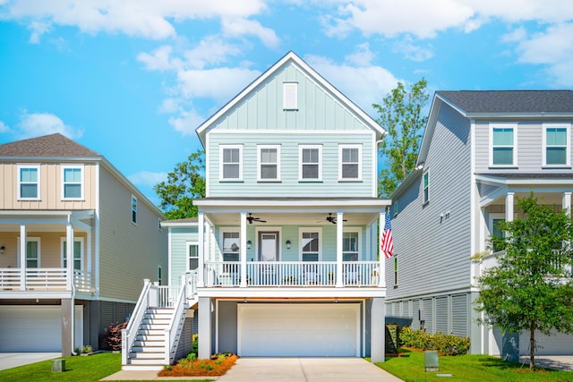 coastal home with a porch, a garage, and a front yard