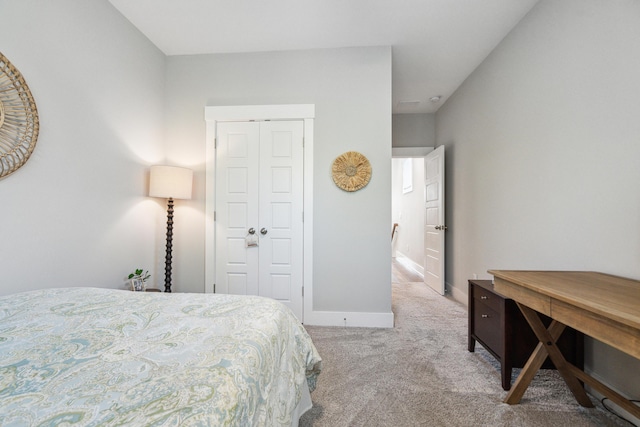 carpeted bedroom featuring a closet