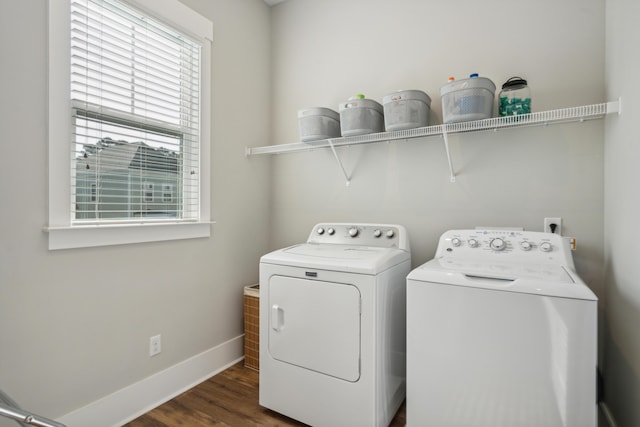 washroom featuring dark wood-type flooring and washing machine and clothes dryer