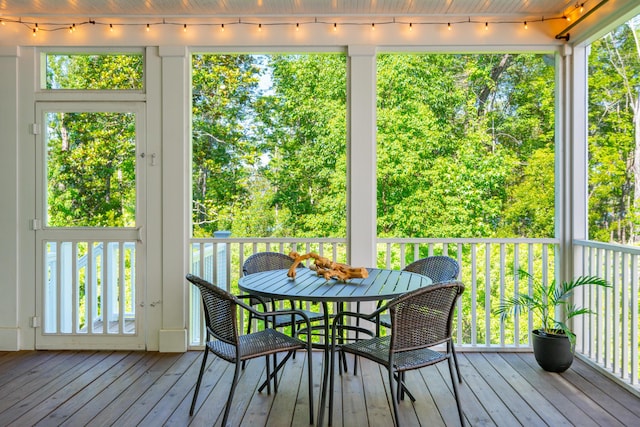 sunroom / solarium featuring a healthy amount of sunlight