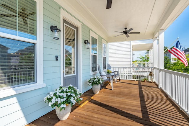 wooden deck featuring ceiling fan