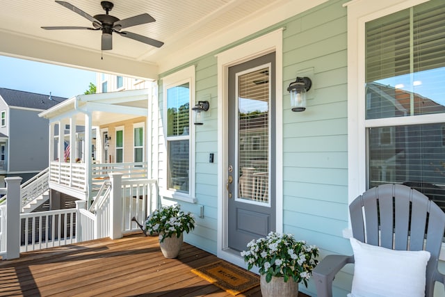 wooden deck with ceiling fan and covered porch