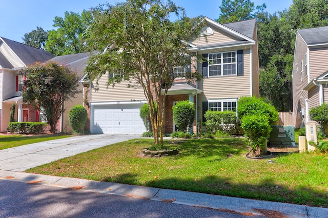 view of front of house with a garage and a front lawn