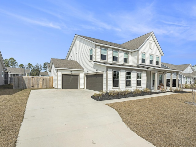 view of front facade with driveway, a garage, fence, and roof with shingles