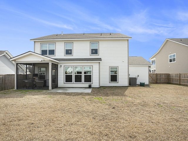 back of property featuring central AC, a lawn, a patio area, and a fenced backyard