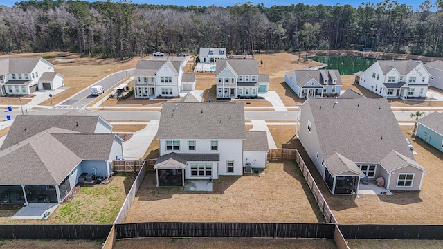 bird's eye view featuring a residential view and a forest view