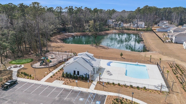 birds eye view of property with a water view