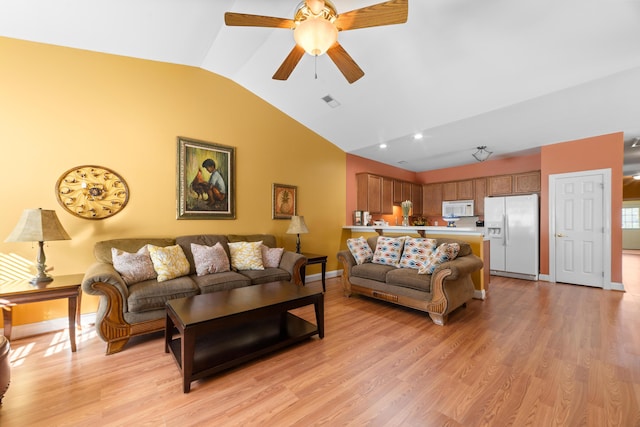 living room with vaulted ceiling, ceiling fan, and light hardwood / wood-style flooring