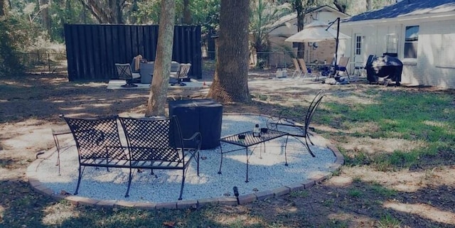 view of yard with a patio and fence