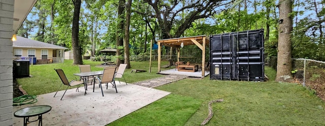 view of yard featuring a patio and central AC