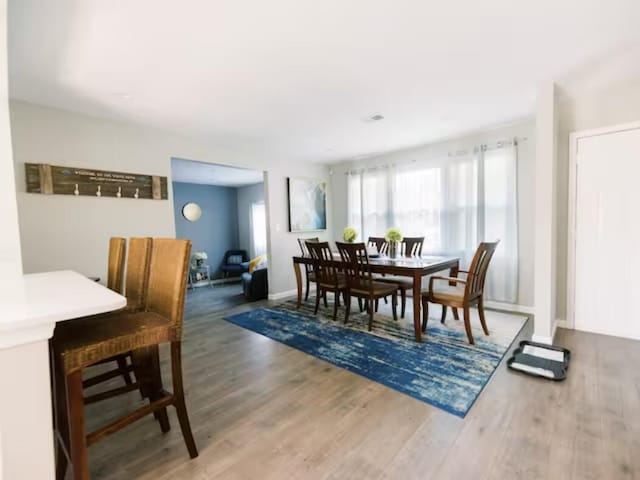 dining area with wood finished floors