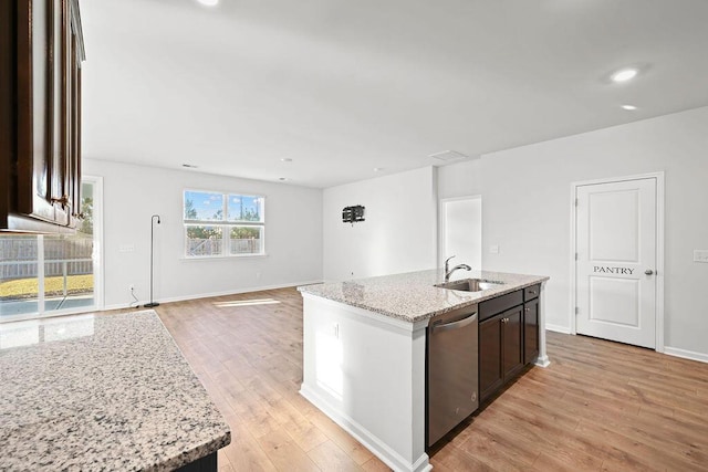 261 Celestial Blvd, Summerville, SC 29486 - kitchen featuring dishwasher, a sink, light wood-style flooring, light stone counters, and recessed lighting