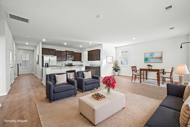 261 Celestial Blvd, Summerville, SC 29486 - living room with light wood-type flooring, recessed lighting, and baseboards