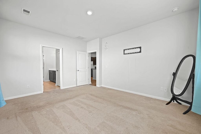 261 Celestial Blvd, Summerville, SC 29486 - unfurnished bedroom with light colored carpet, baseboards, and ensuite bath