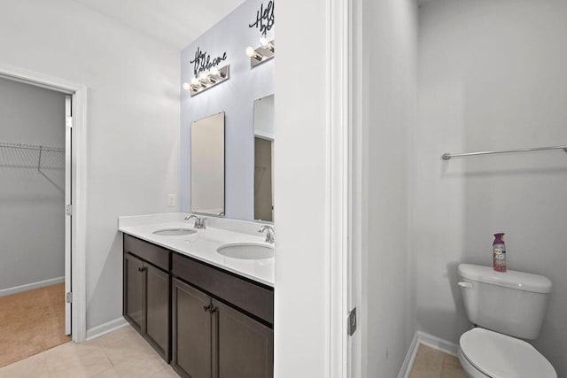 261 Celestial Blvd, Summerville, SC 29486 - full bath with toilet, double vanity, a walk in closet, and baseboards