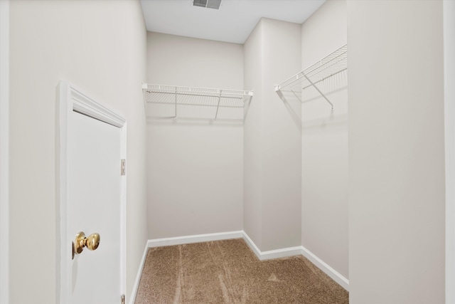 walk in closet with carpet flooring and visible vents