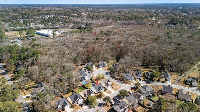 bird's eye view with a forest view and a residential view