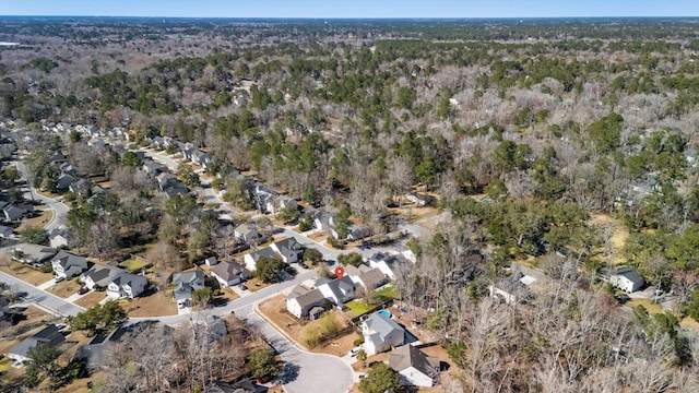 birds eye view of property with a residential view and a view of trees