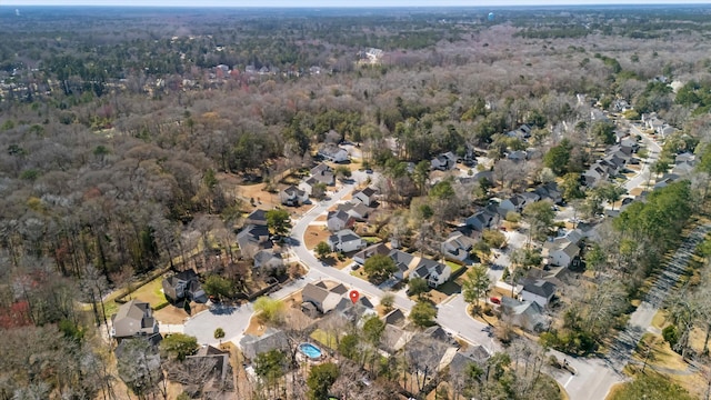 birds eye view of property featuring a residential view and a forest view