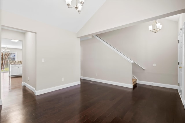 interior space with stairs, lofted ceiling, dark wood-style flooring, and an inviting chandelier