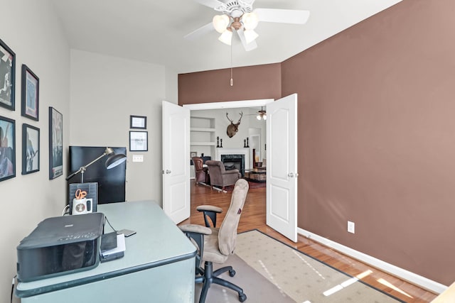 2257 Magnolia Meadows Dr, Mount Pleasant, SC 29464 - office area with a ceiling fan, a fireplace, wood finished floors, and baseboards