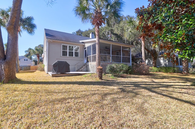 2257 Magnolia Meadows Dr, Mount Pleasant, SC 29464 - back of property featuring a sunroom, a lawn, ceiling fan, and a chimney