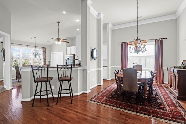 2257 Magnolia Meadows Dr, Mount Pleasant, SC 29464 - dining room featuring a chandelier, dark wood-type flooring, ornamental molding, a ceiling fan, and baseboards