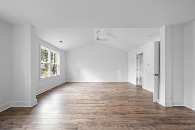 unfurnished room with ceiling fan, dark wood-type flooring, and vaulted ceiling