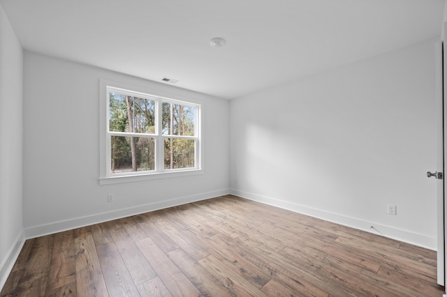 empty room featuring hardwood / wood-style floors