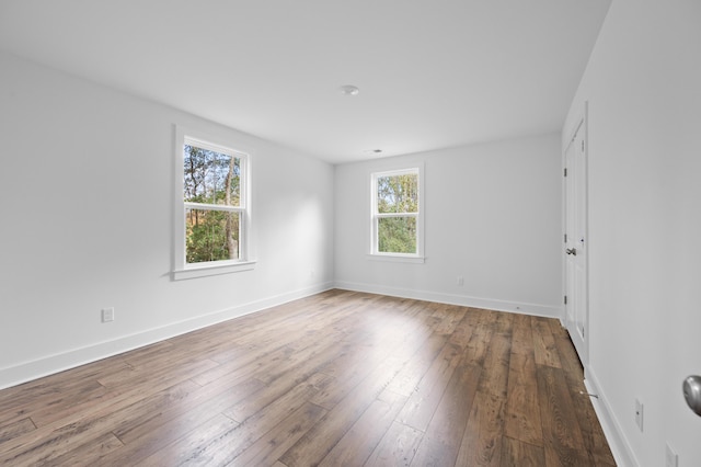 spare room with hardwood / wood-style floors