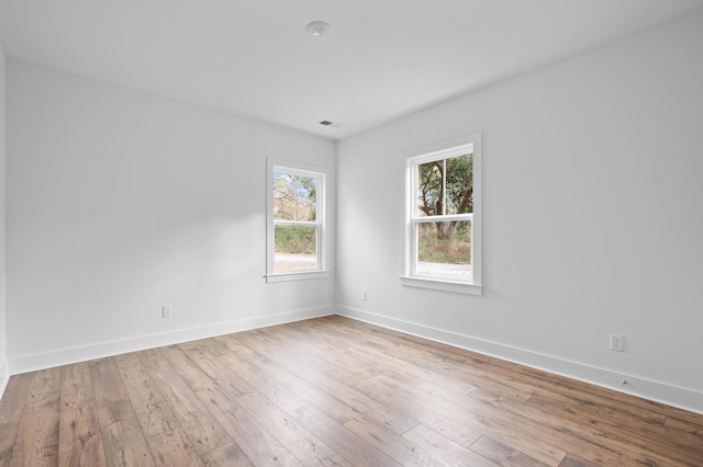 spare room with light wood-type flooring