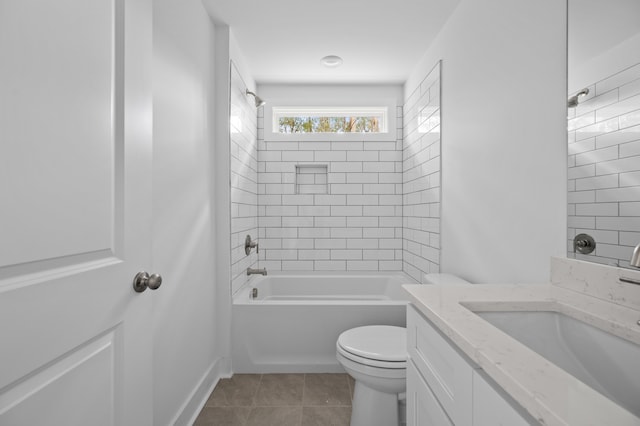 full bathroom with toilet, vanity, tiled shower / bath combo, and tile patterned floors