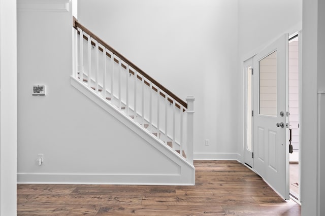 entrance foyer with dark hardwood / wood-style floors