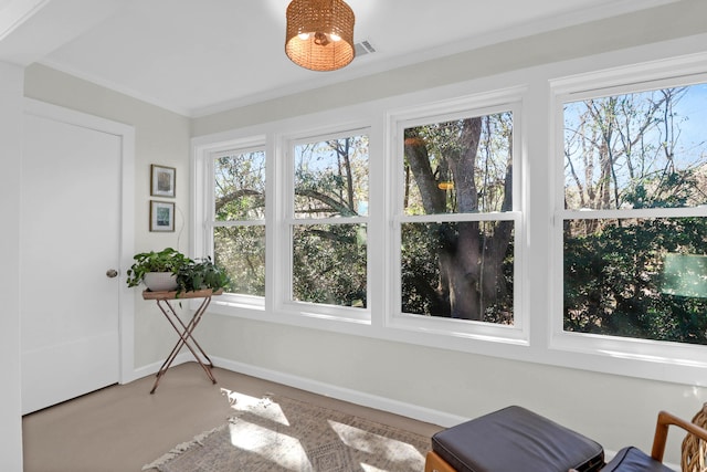 sunroom featuring plenty of natural light and visible vents