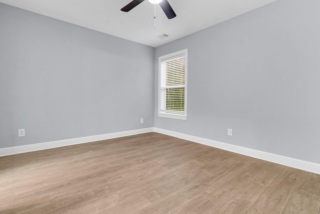 spare room with light hardwood / wood-style floors and ceiling fan