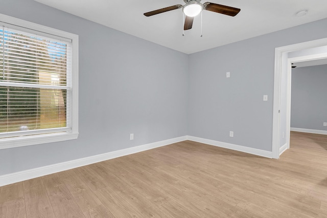 unfurnished room with ceiling fan and light wood-type flooring