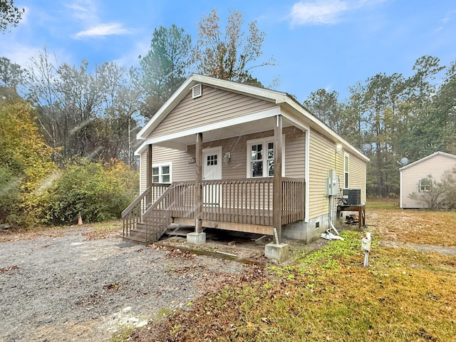 bungalow-style house featuring central air condition unit