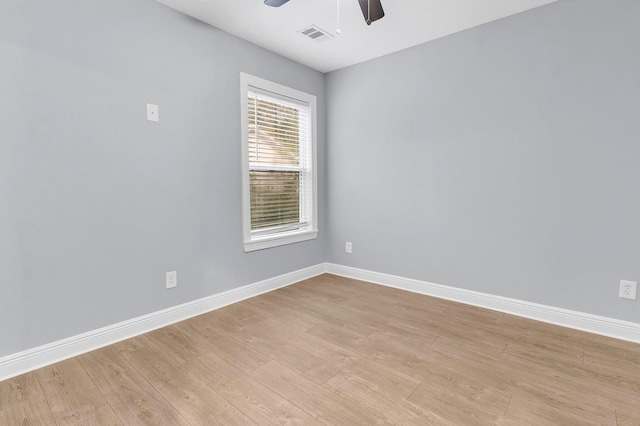 unfurnished room featuring ceiling fan and light wood-type flooring