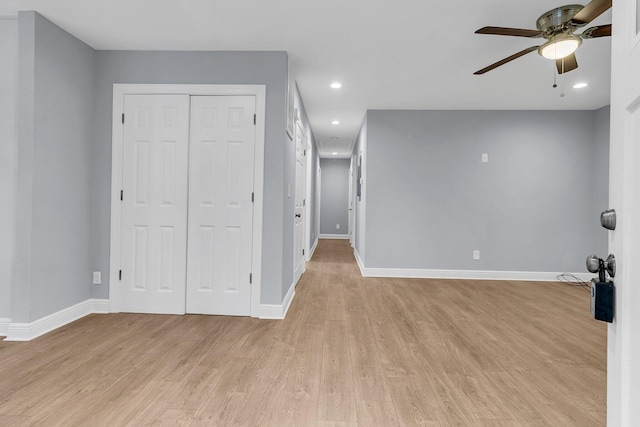 spare room featuring ceiling fan and light wood-type flooring