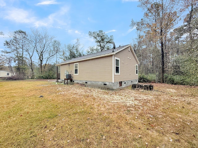 view of side of property with a yard